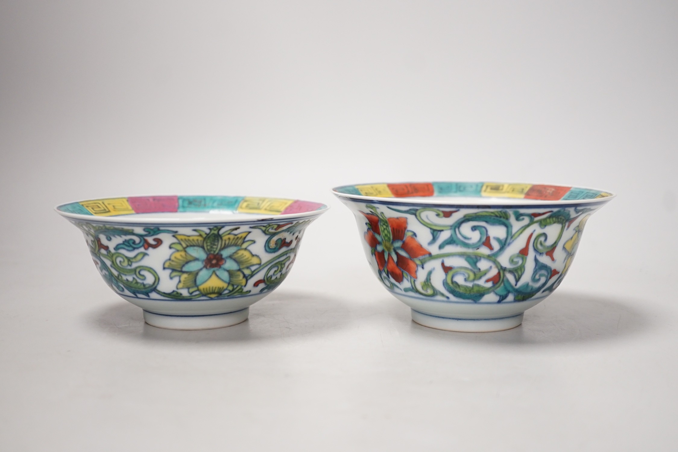 A near pair of Chinese doucai bowls. Tallest 7cm